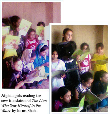 Afghan girls reading The Lion Who Saw Himself in the Water